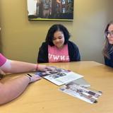 Students reviewing a book.